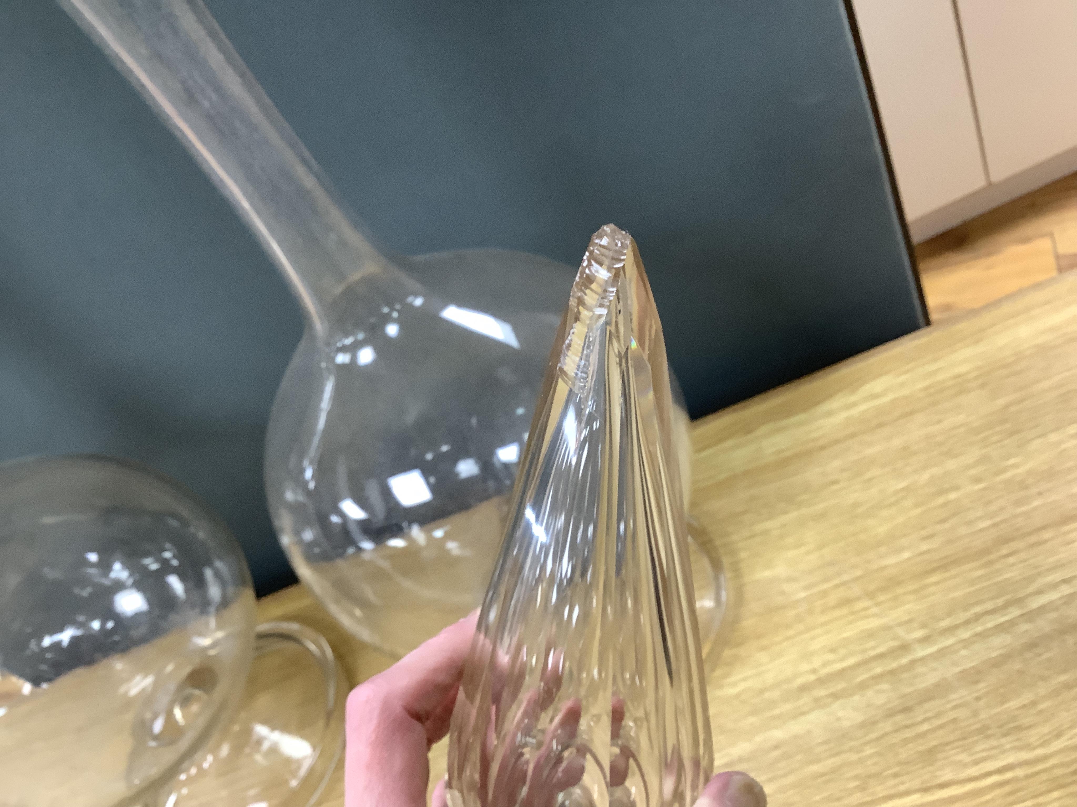 A pair of large clear glass chemist window display bottles and stoppers, one with chip, 90cm high